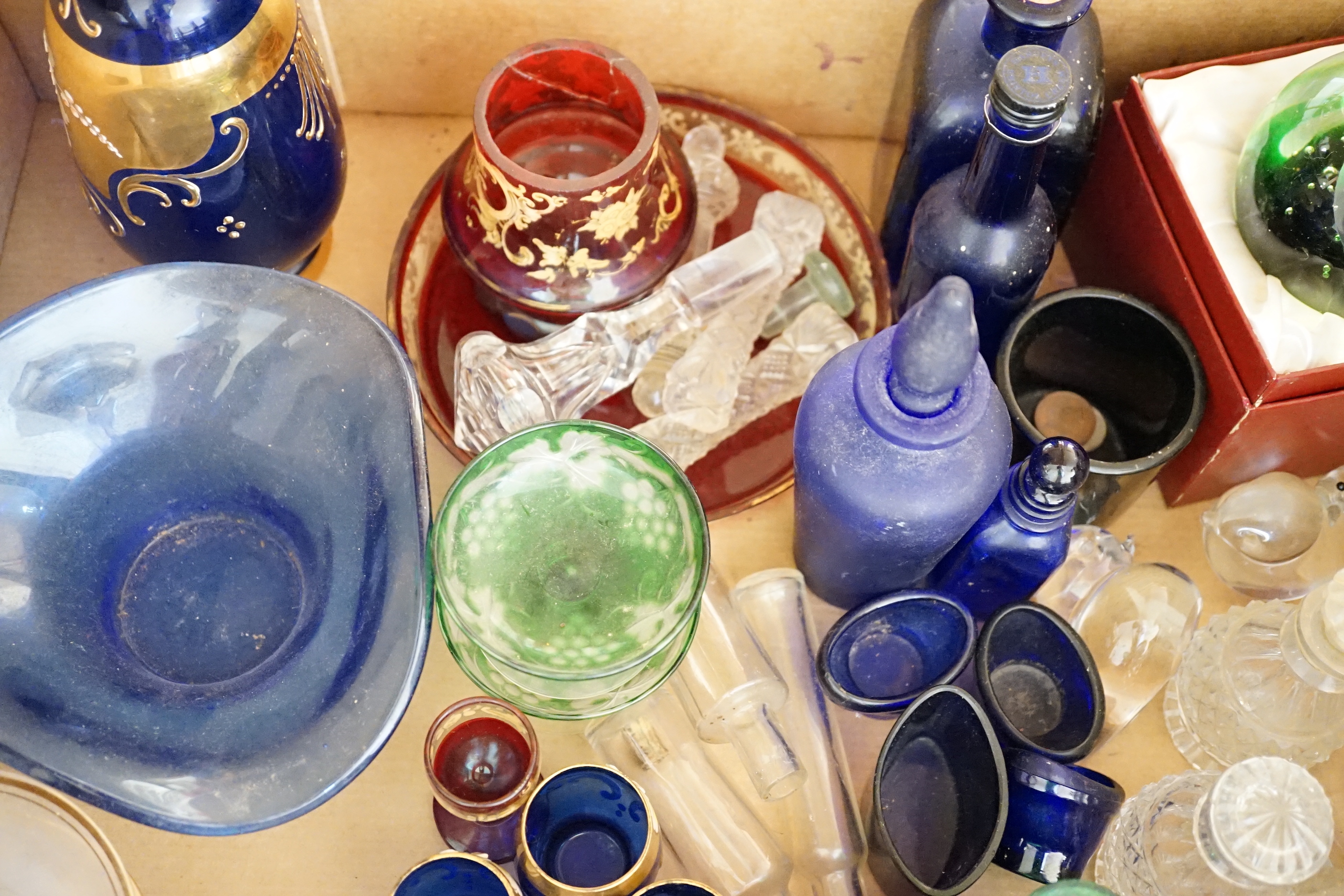 A collection of clear and coloured glassware